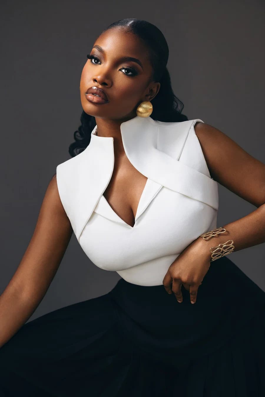 A close portrait of the Adele Set with its white sculpted neckline.