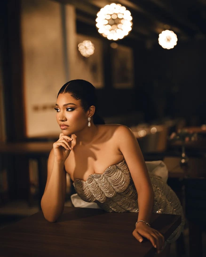 The Dewdrop bridal gown in an evening interior.