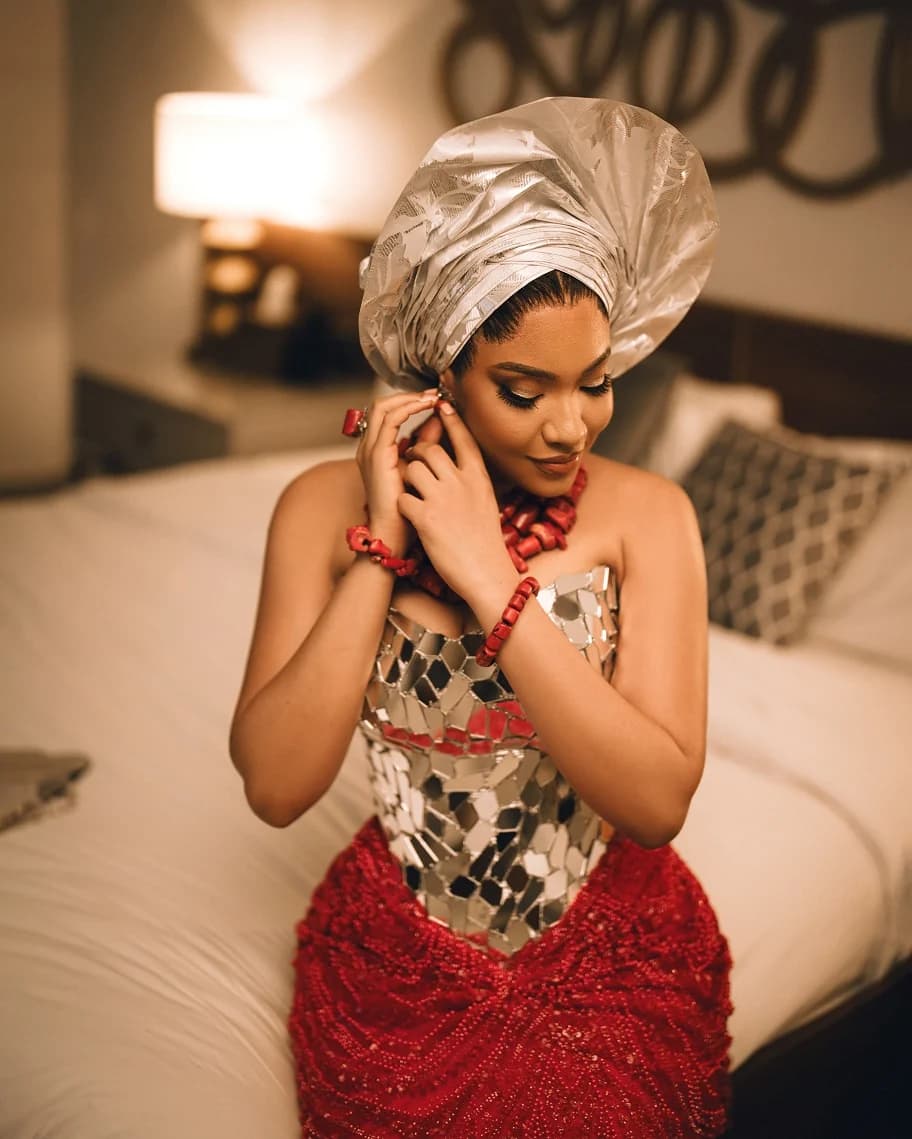 The Ifenkili bridal look with a sculptural silver headpiece.